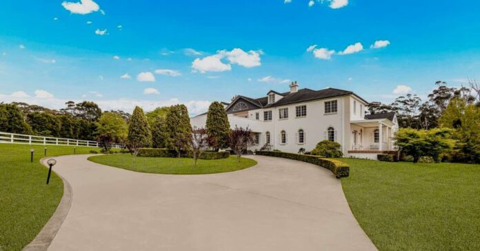 dural mansion with grand circular driveway