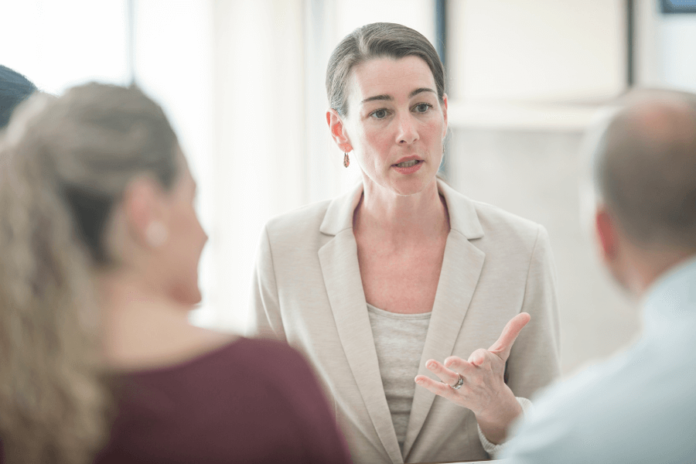 Buyers' agent talking to clients